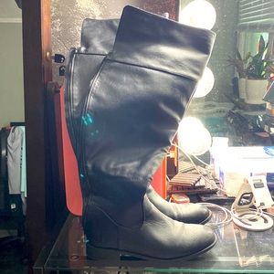 Over the knee black boots. Never worn outside.